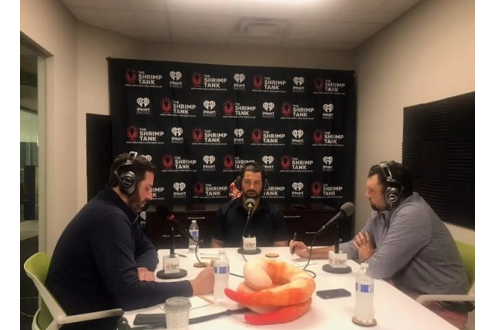 a group of men wearing headphones