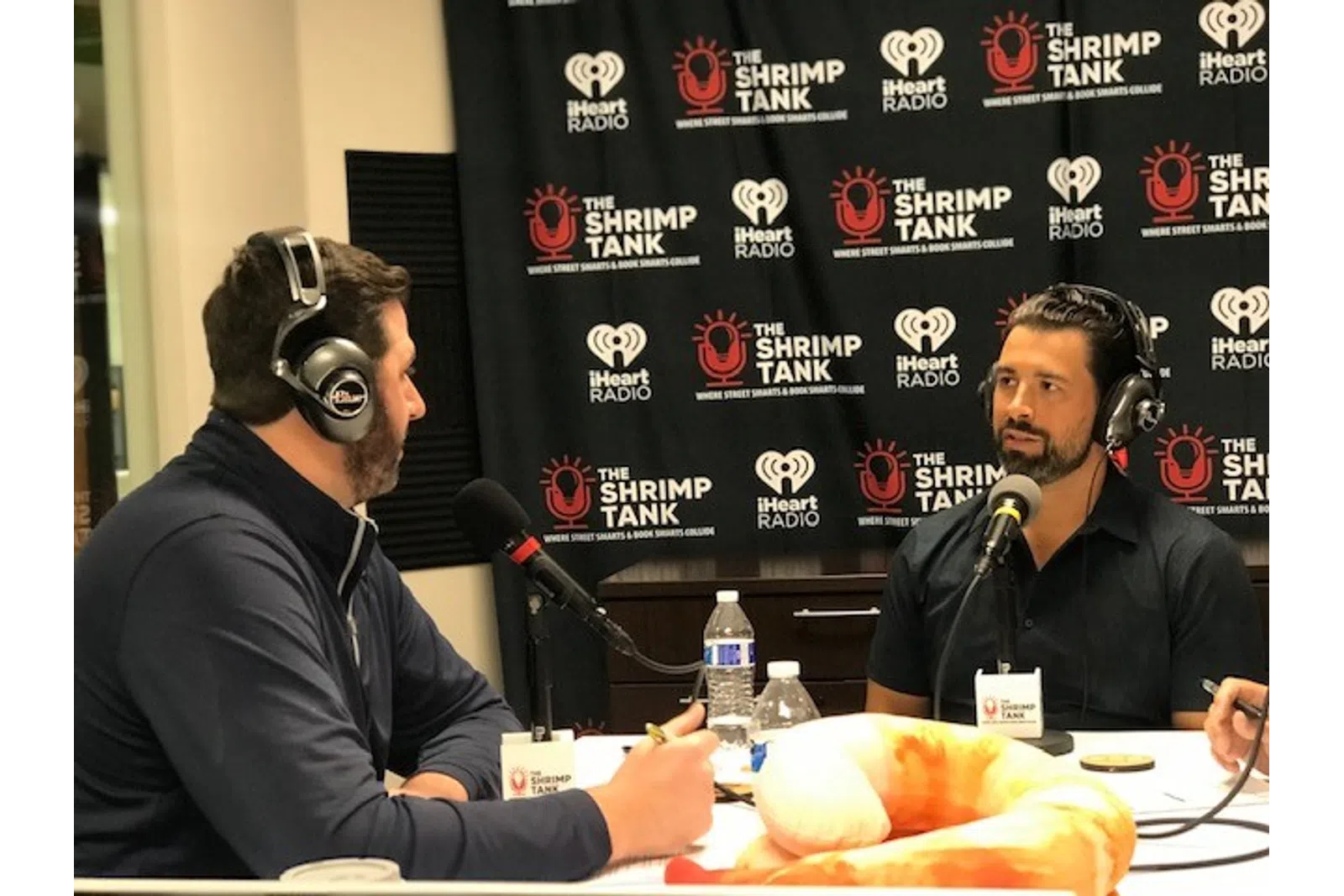 a couple of men wearing headphones