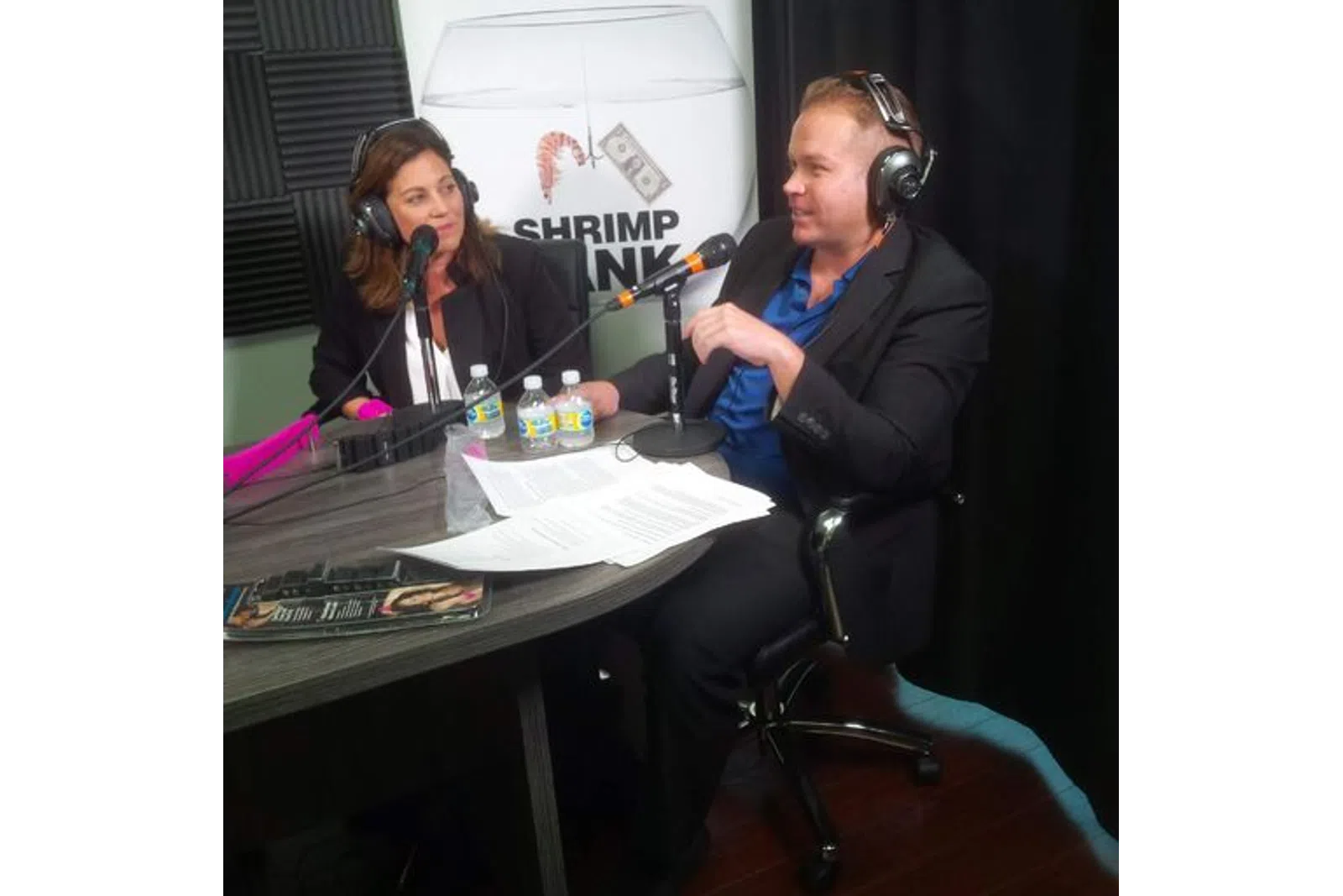 a man and woman wearing headphones