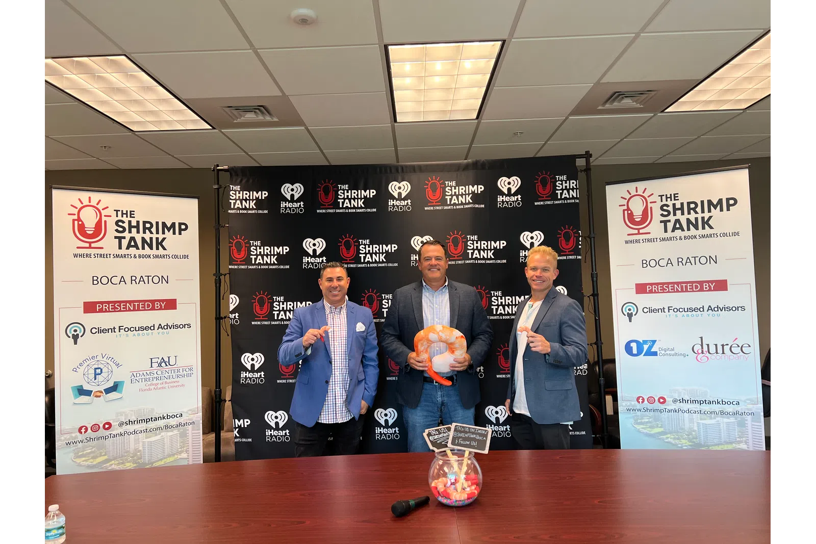 a group of people holding objects posing for the camera