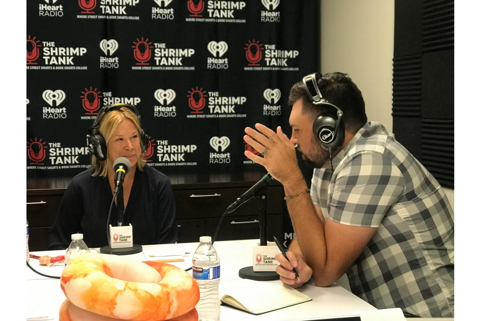 a man and woman wearing headphones