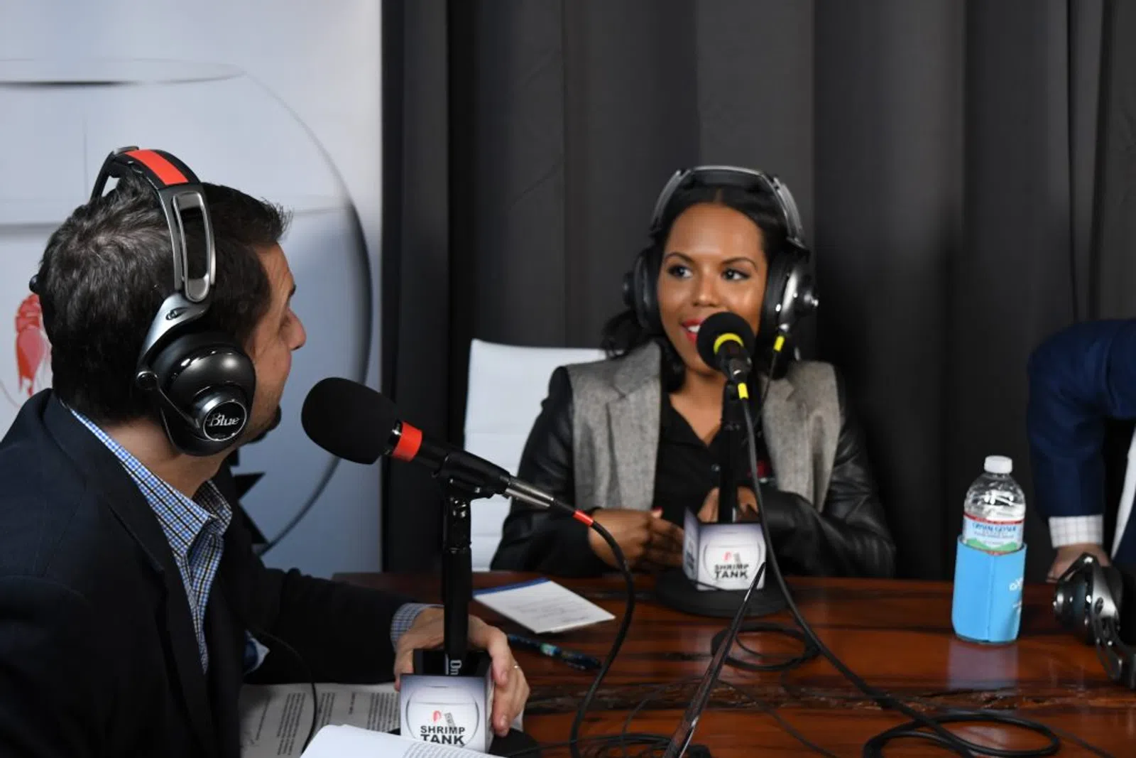 a man and woman wearing headphones