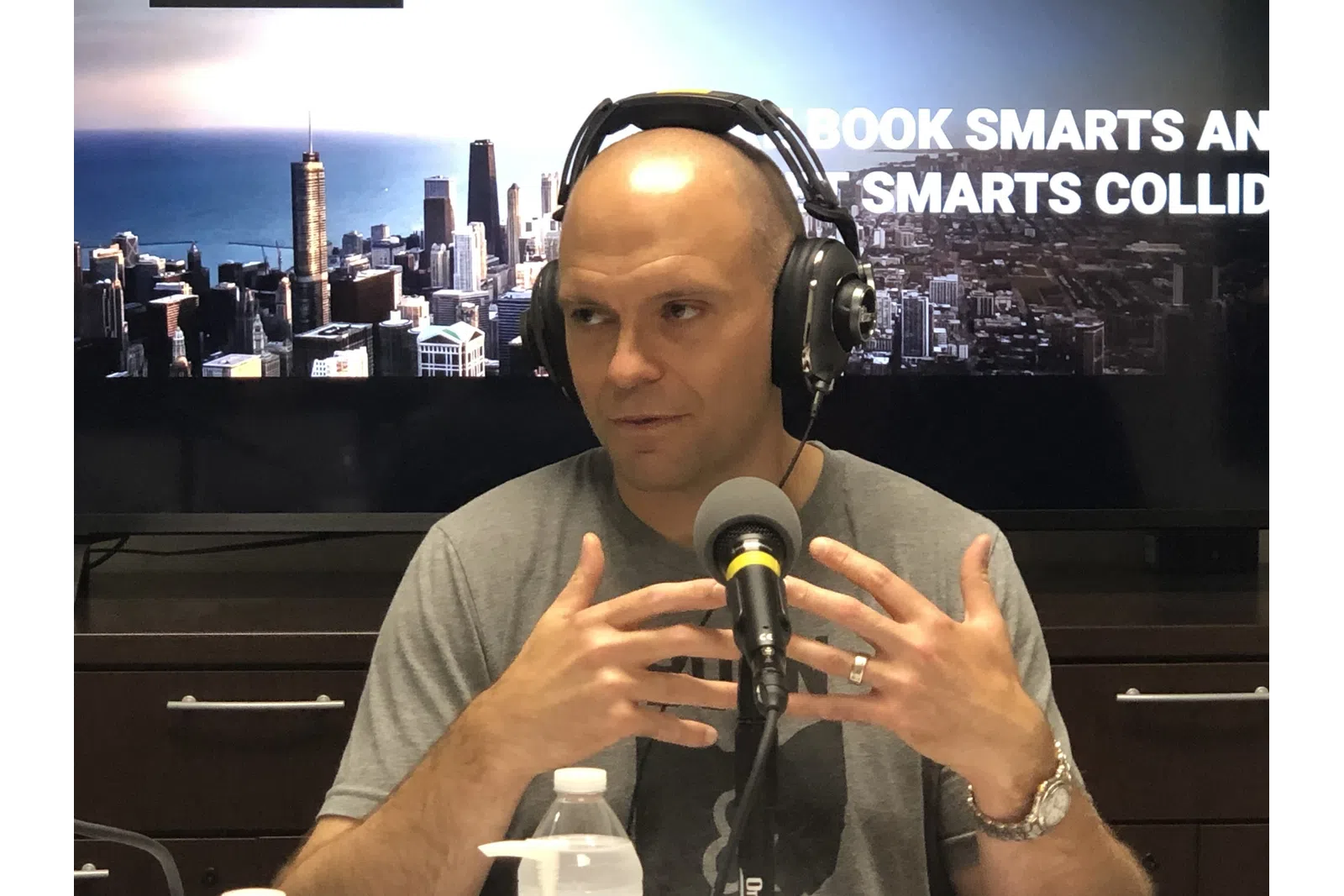 a person wearing headphones and holding a microphone