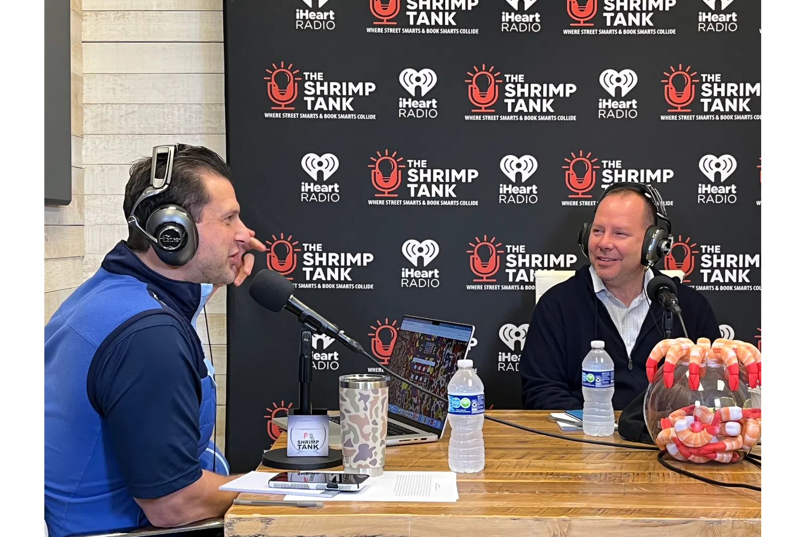 a couple of men wearing headphones