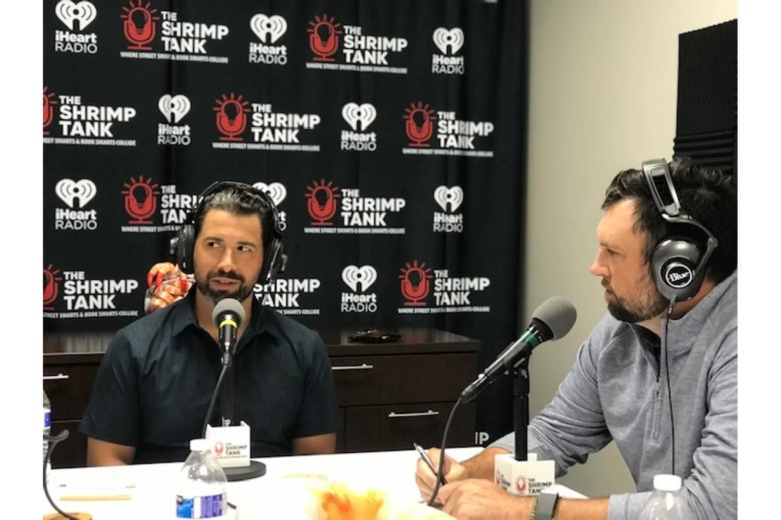 a couple of men wearing headphones