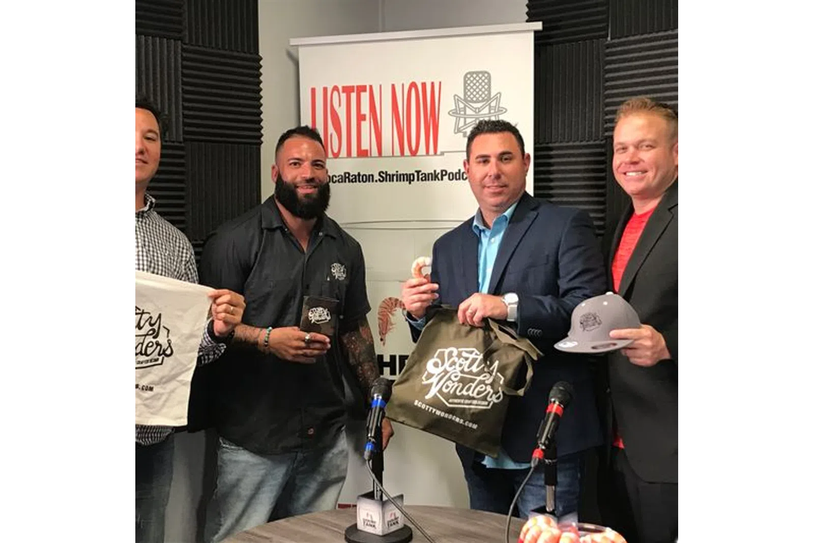 a group of men holding microphones