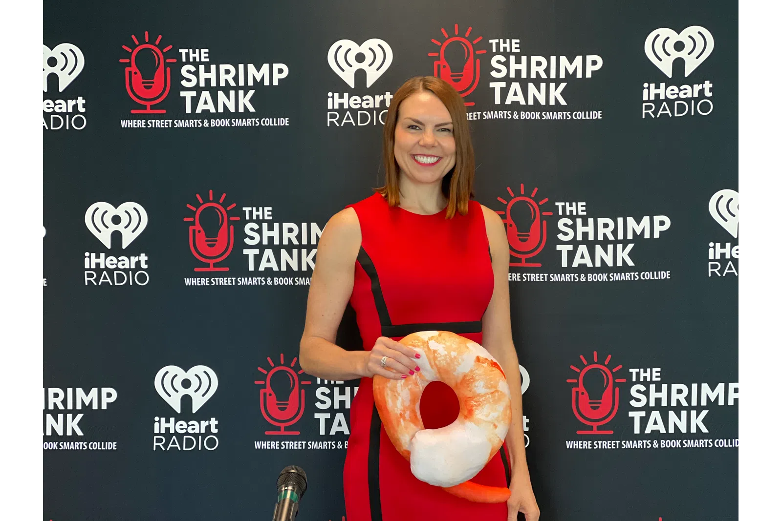 Kate Volman holding a large red and white object
