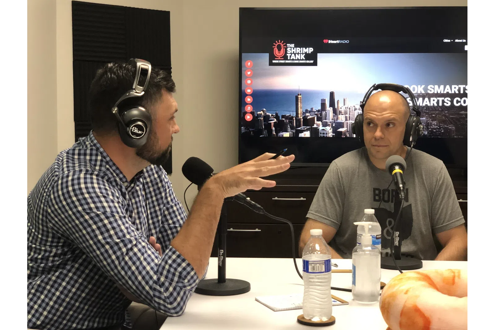 a couple of men wearing headphones