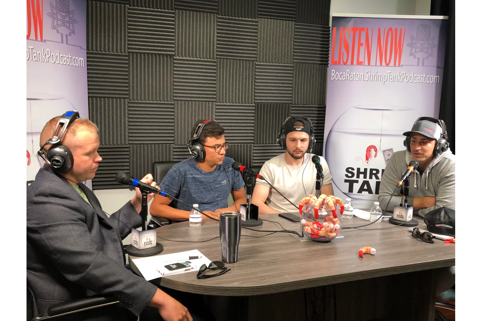a group of men wearing headphones