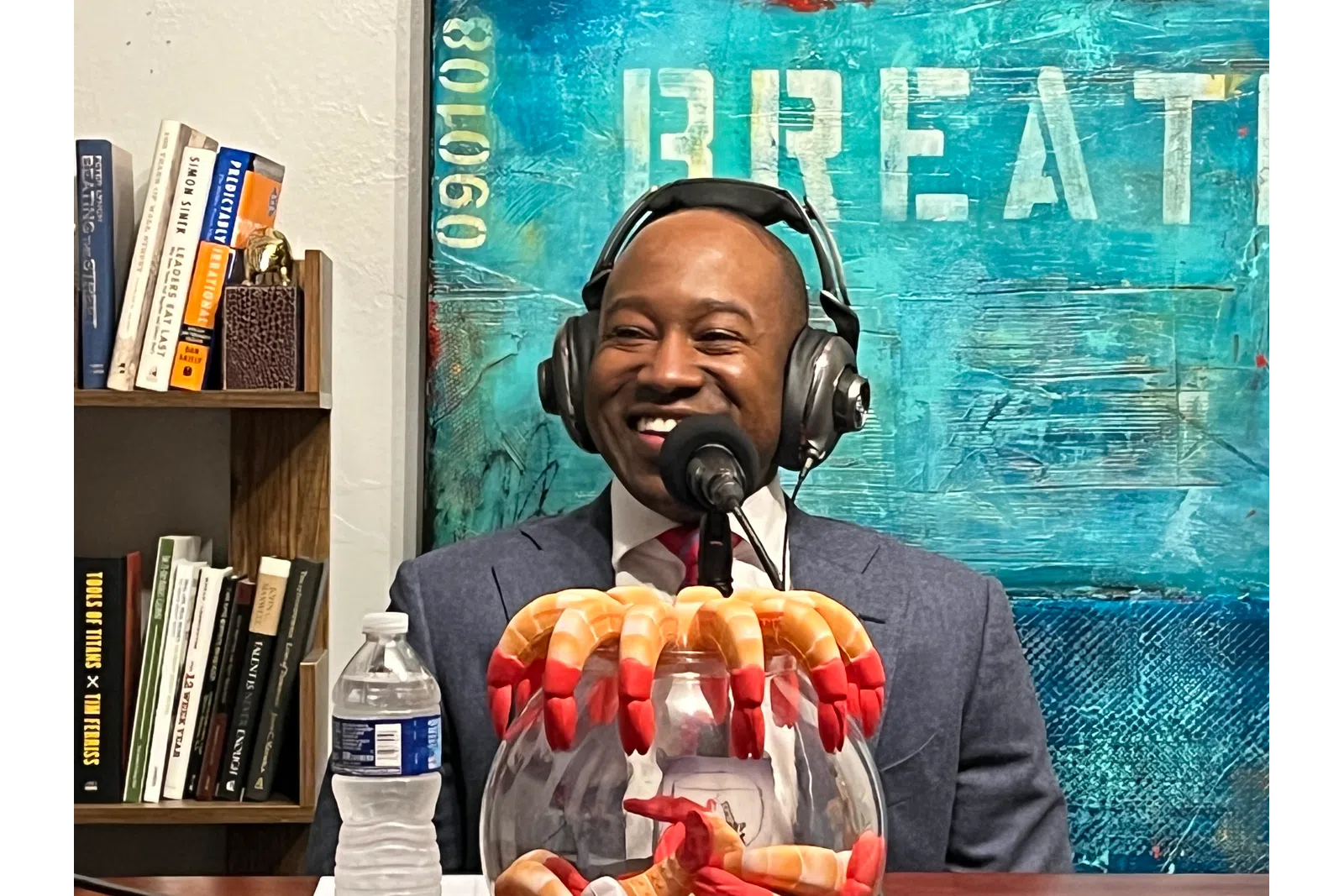 a person wearing headphones and holding a bag of chips