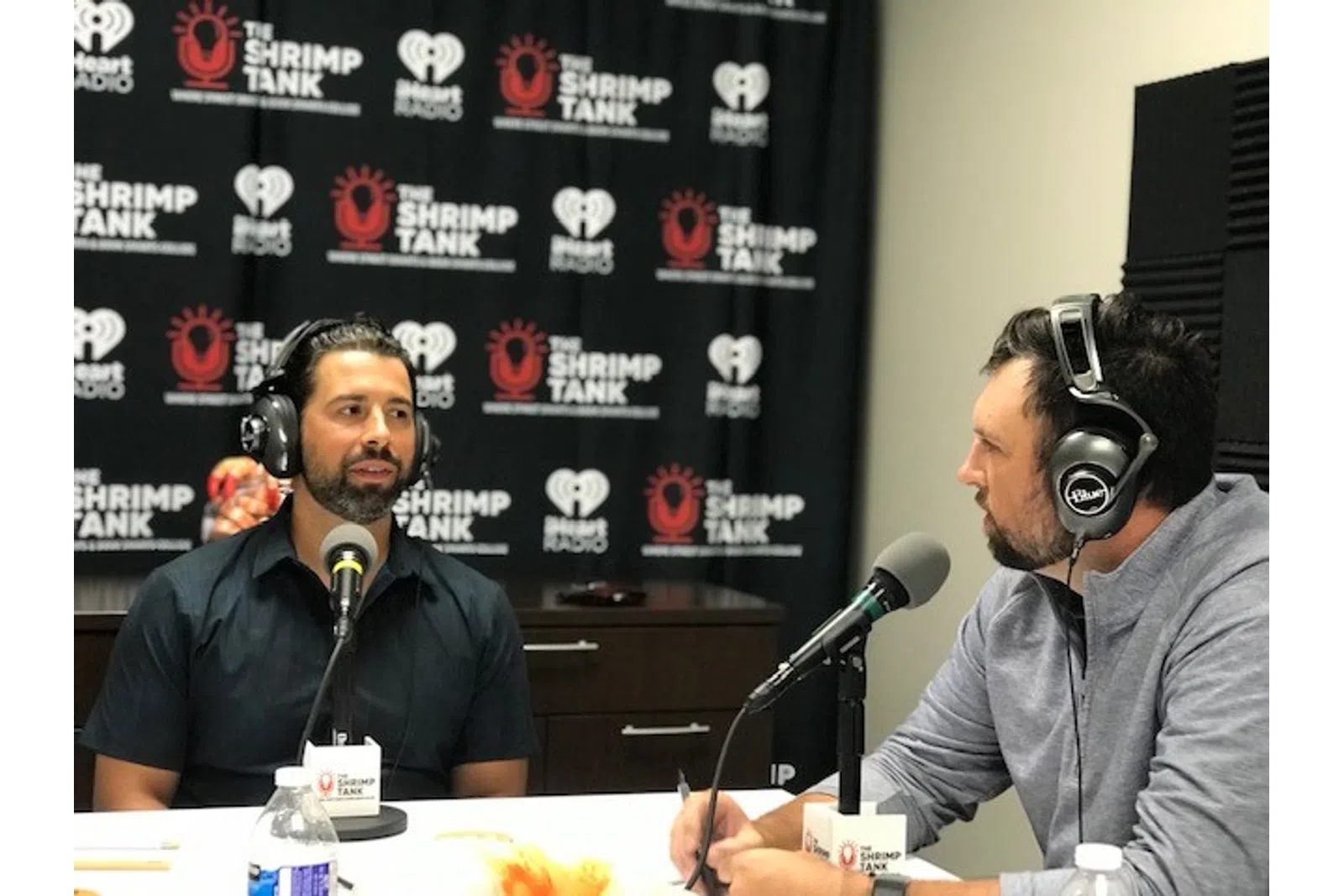 a couple of men wearing headphones