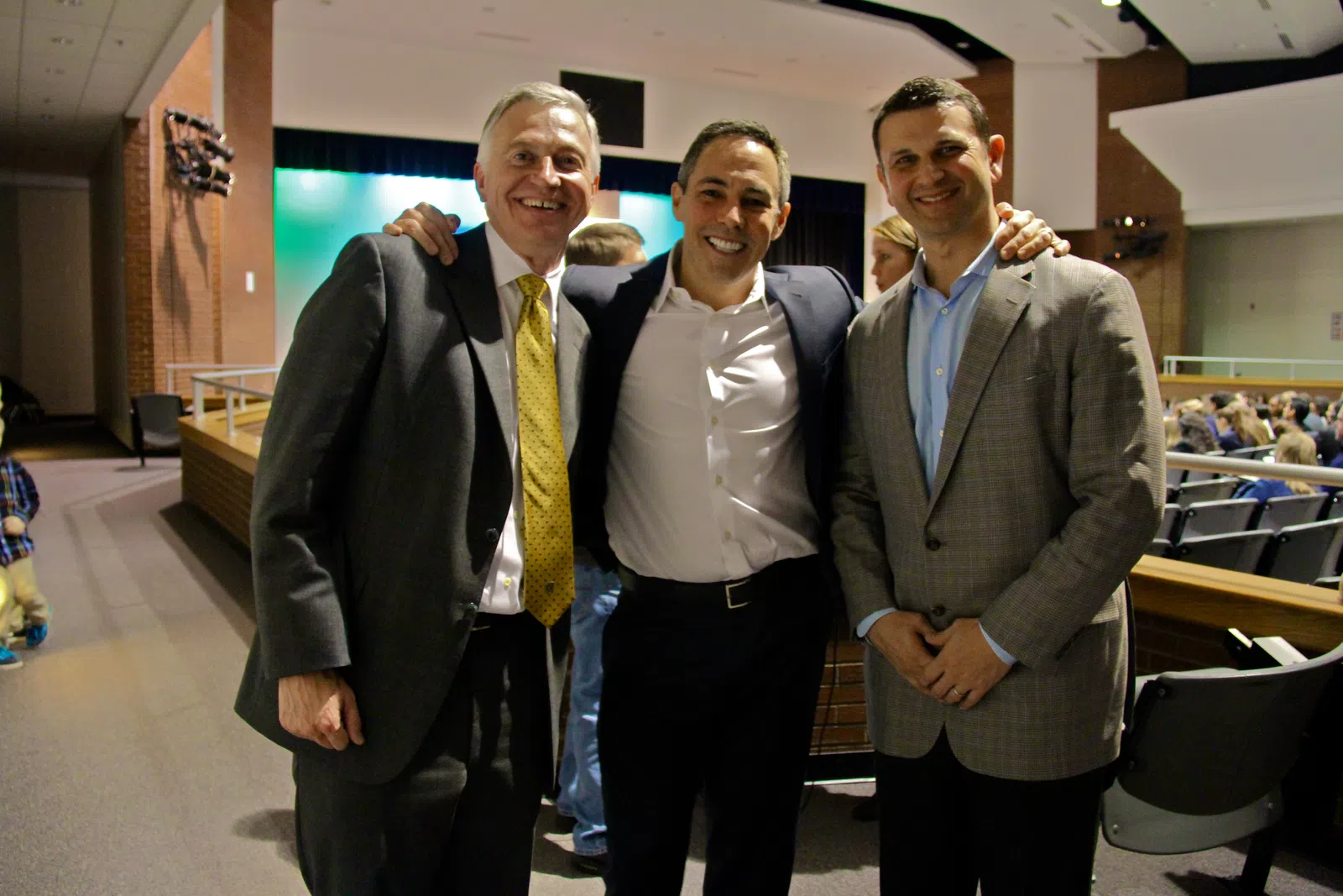 a group of men posing for a photo