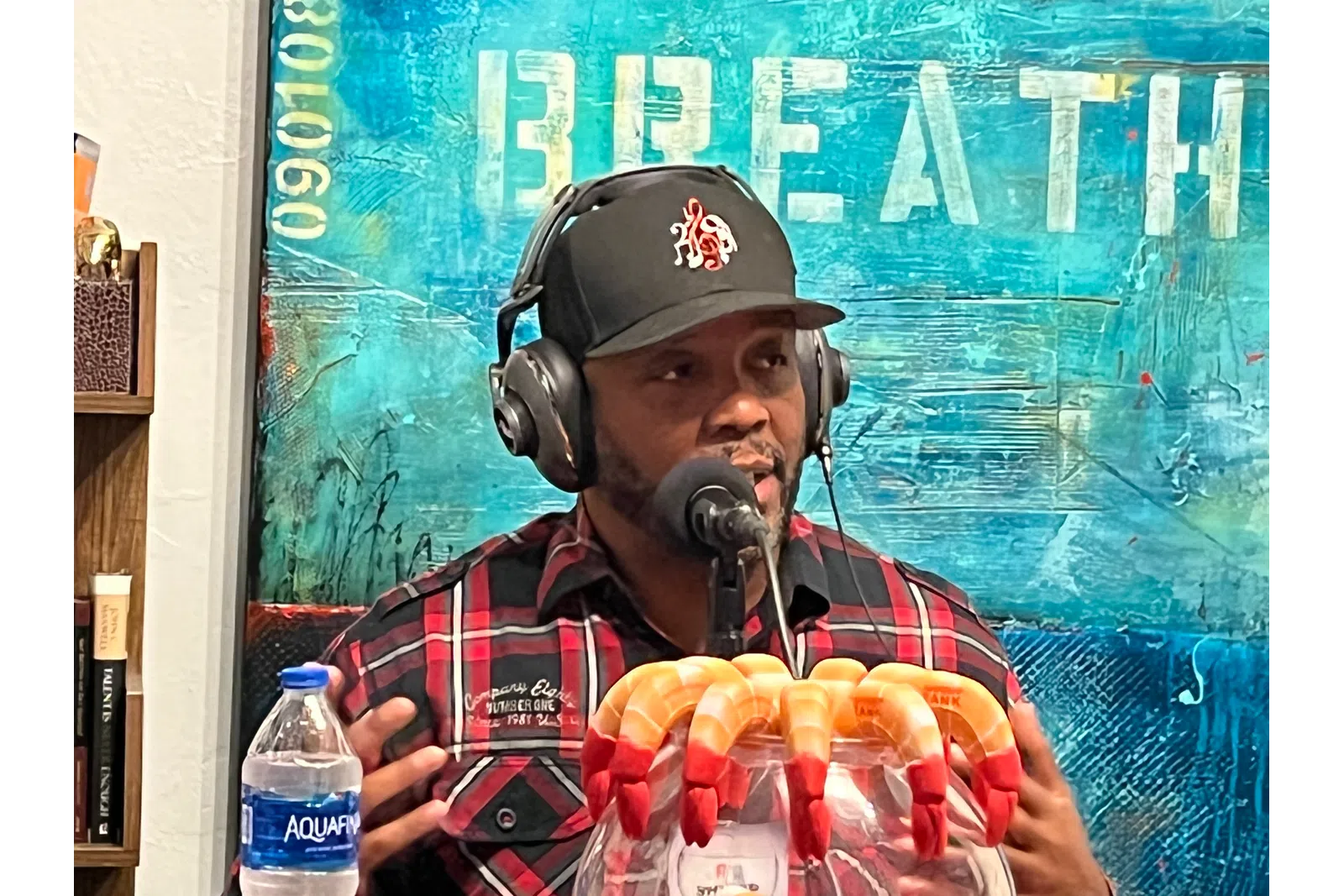 a person wearing a helmet and holding a bag of chips