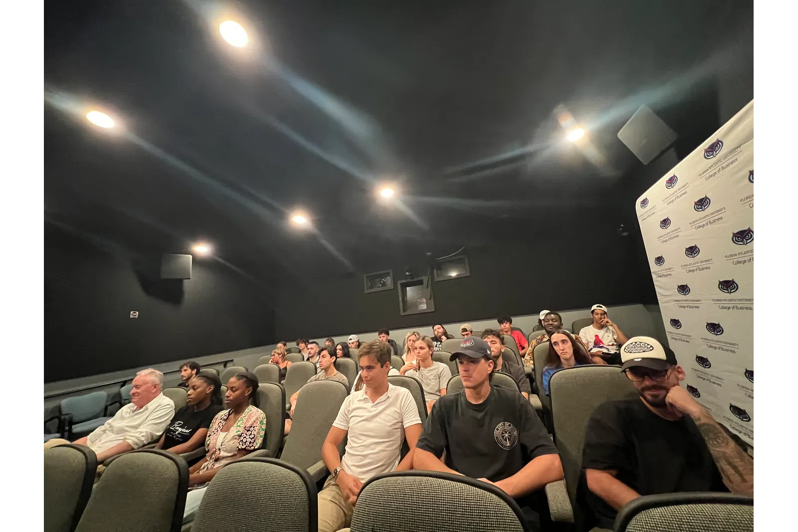 a group of people sitting in a room