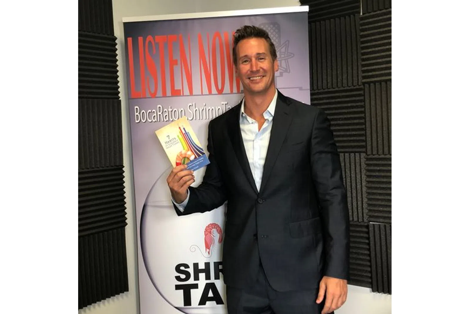 a man holding a book