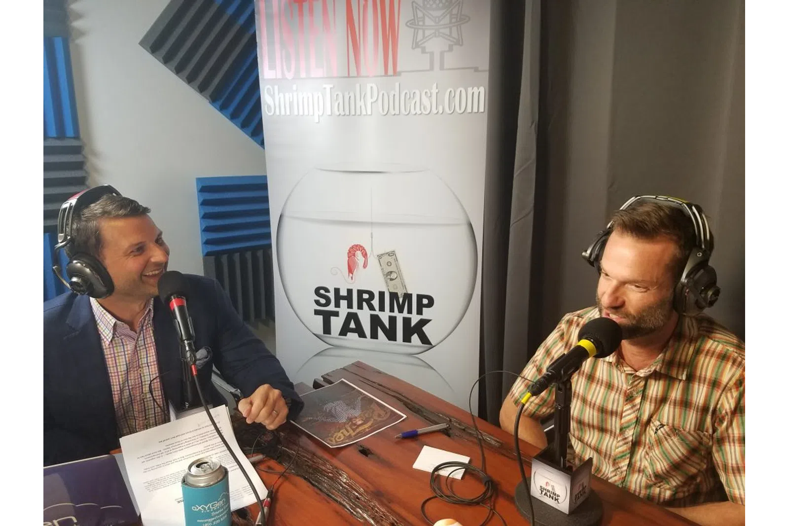 a couple of men wearing headphones