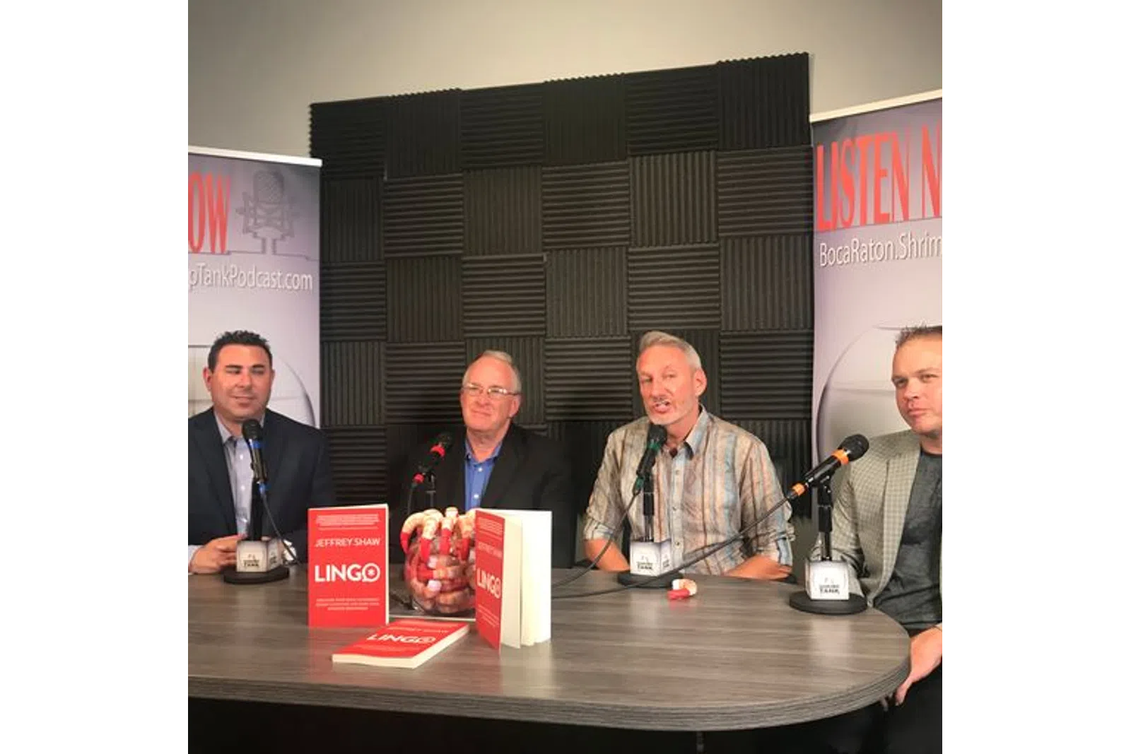 a group of men at a conference