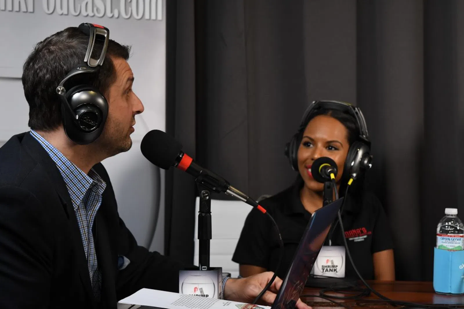a man and woman wearing headphones