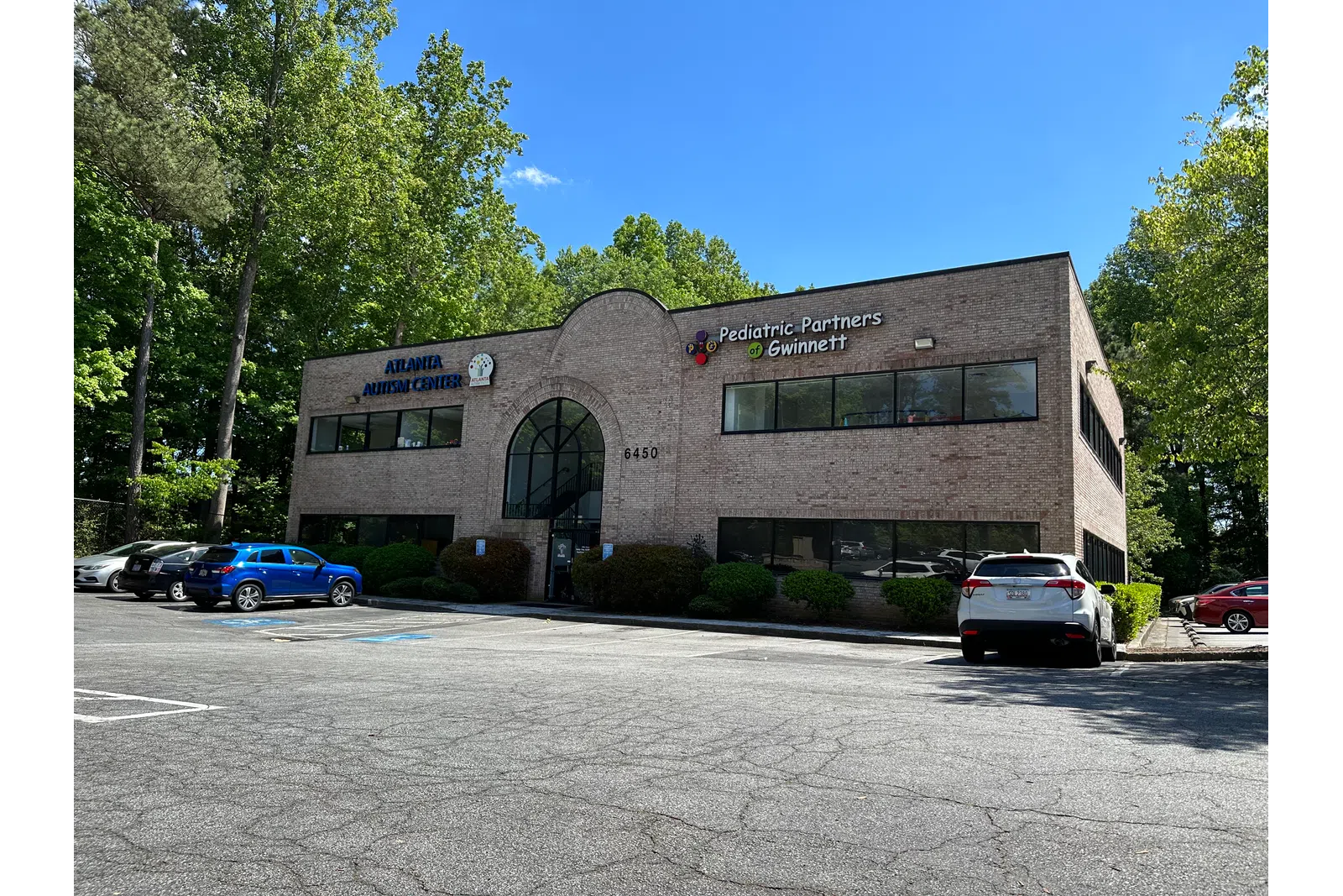 a building with cars parked in front