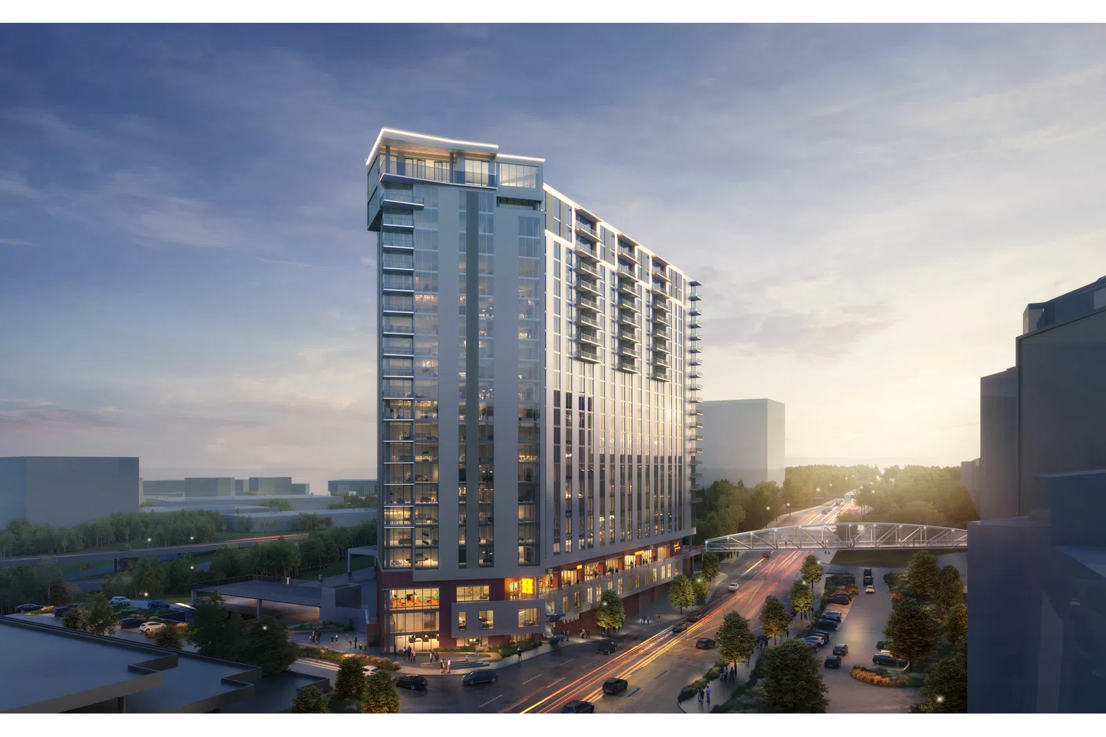 Modern high-rise residential building at sunset with street view and greenery in an urban area