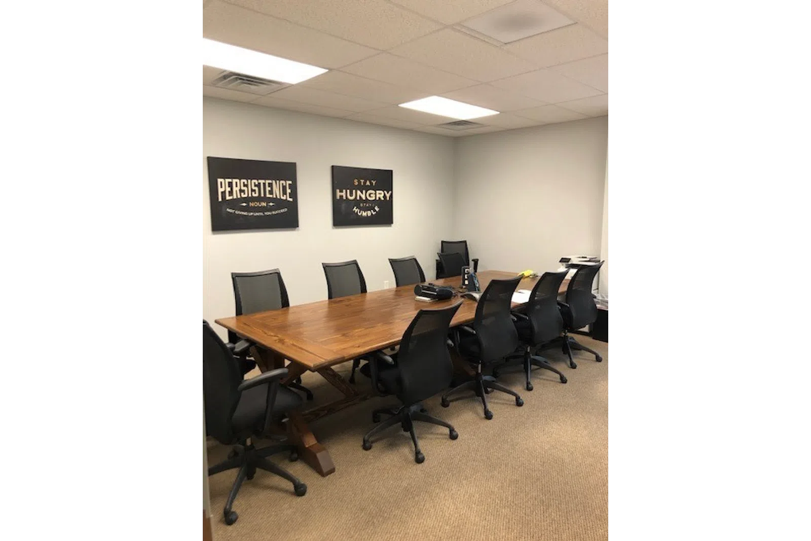 a conference room with a table and chairs