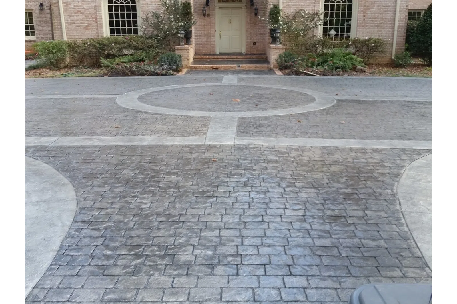 a paved area with a building in the background