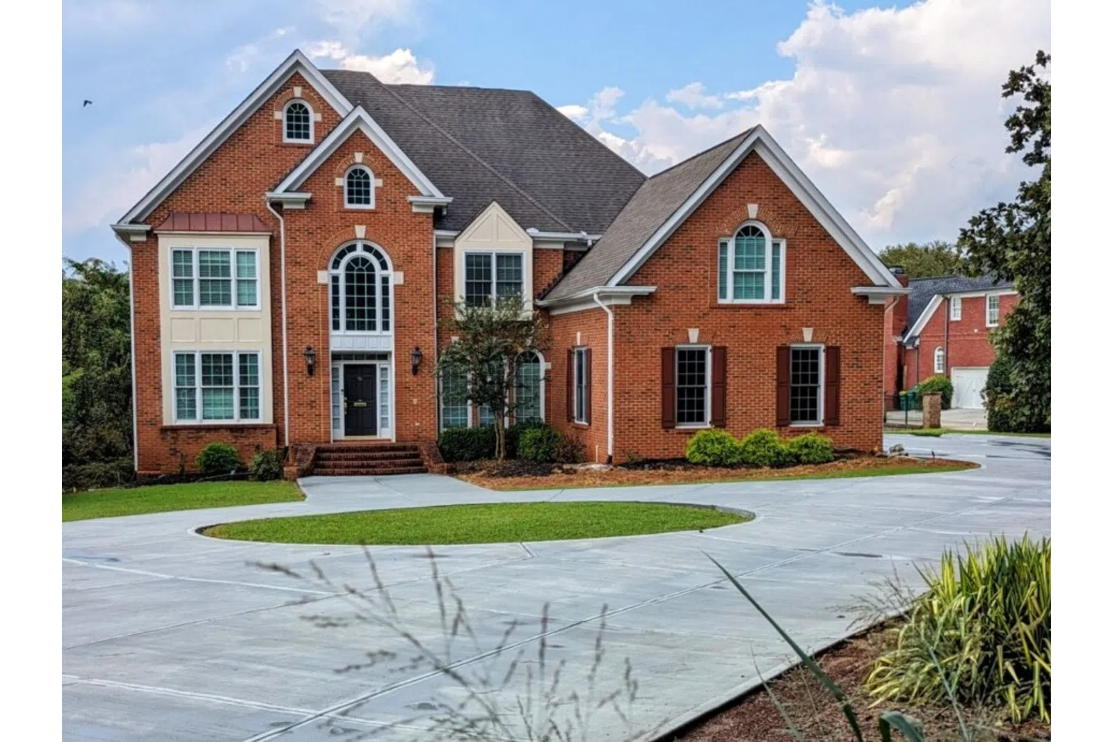a brick house with a driveway