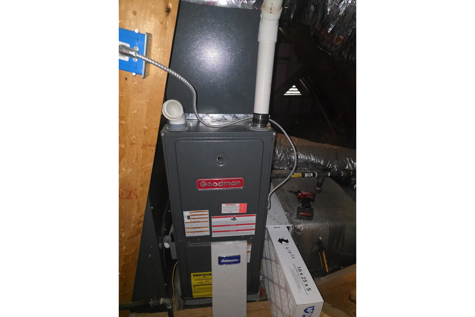 AC Maintenance, Cleaning and Tune-up in Johns Creek by The Air Company of GA. Goodman furnace and GeneralAire air purifier installed in attic with ductwork and air filter nearby.