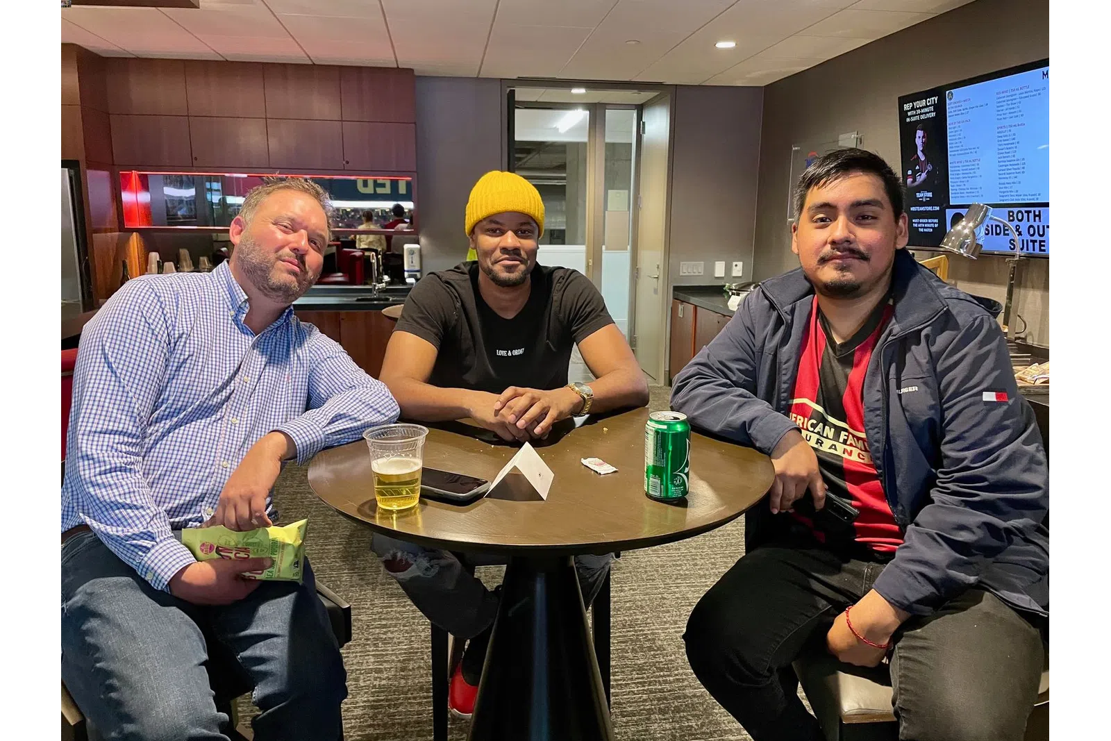 a group of people sitting at a table in a restaurant