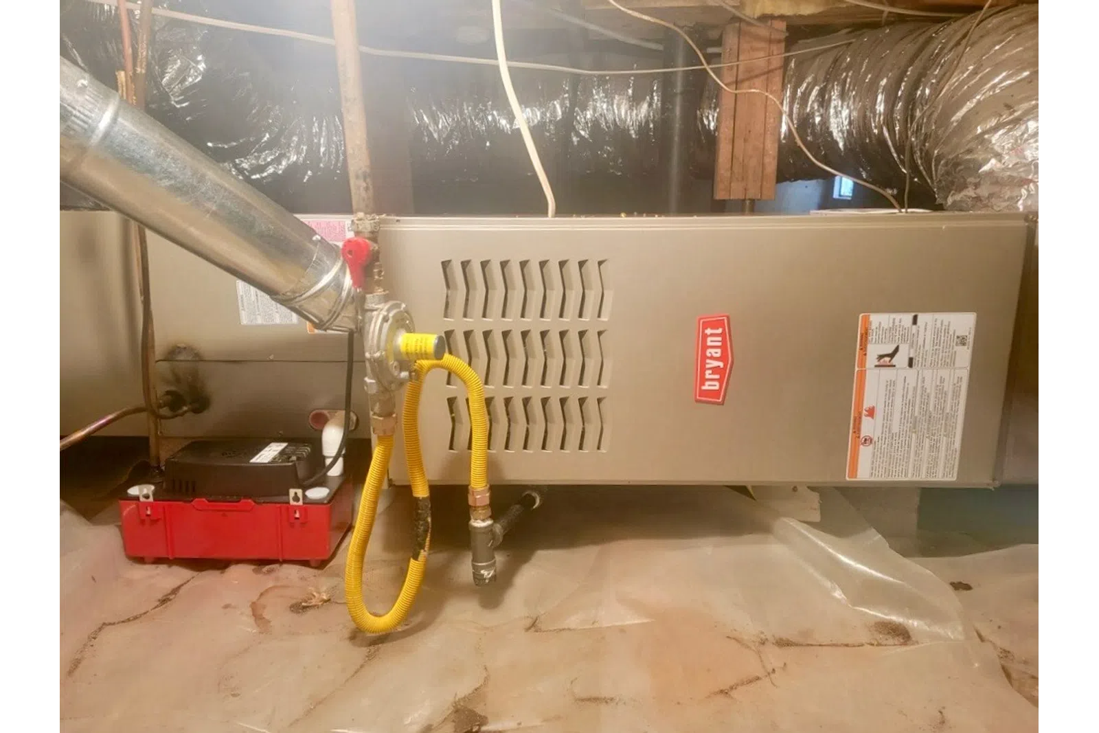 a large metal pipe with yellow wires
