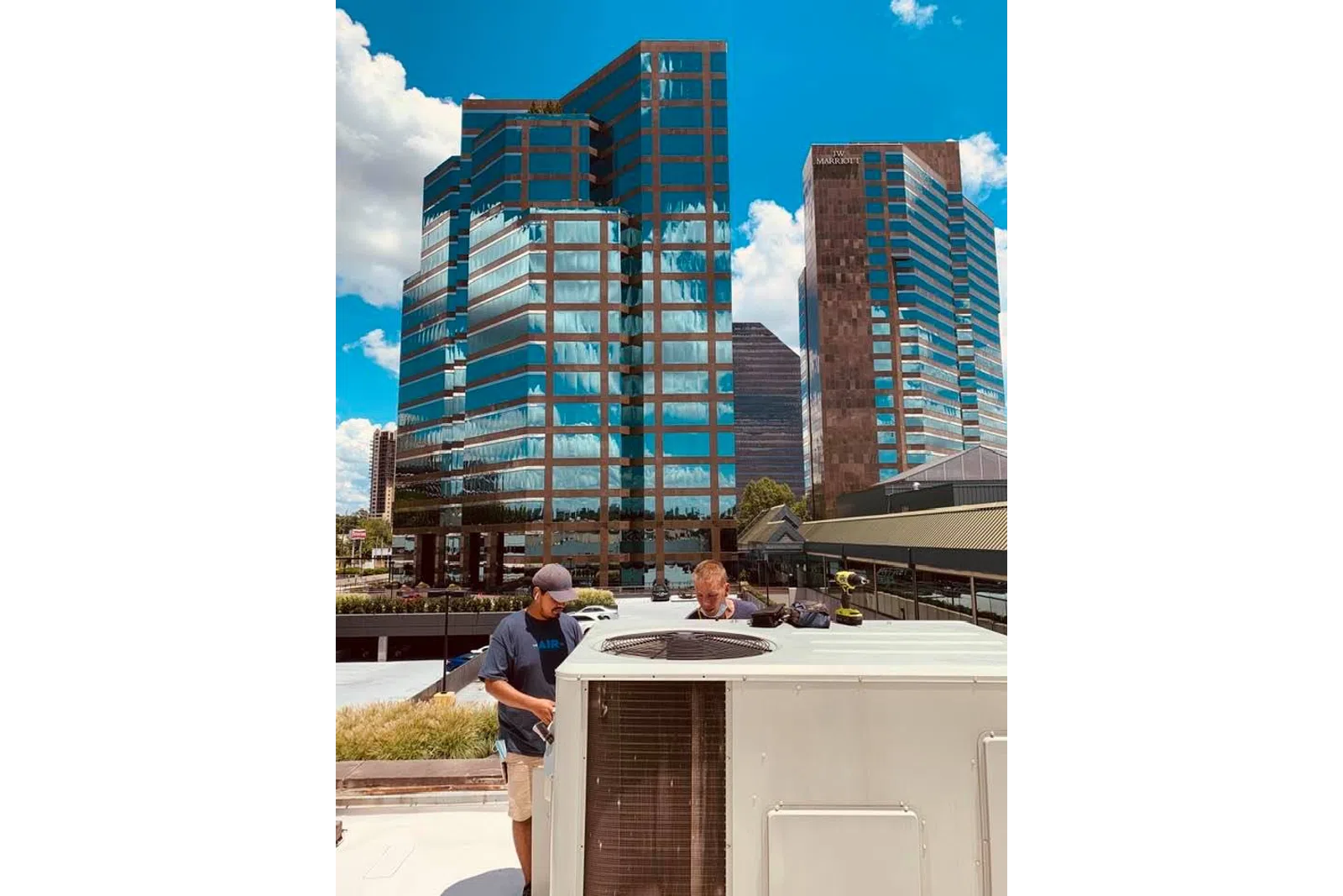 a man standing in front of a tall building