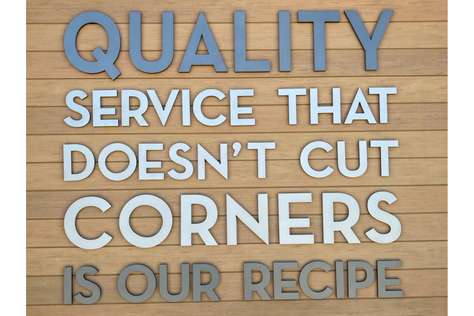 a wood surface with text on it
