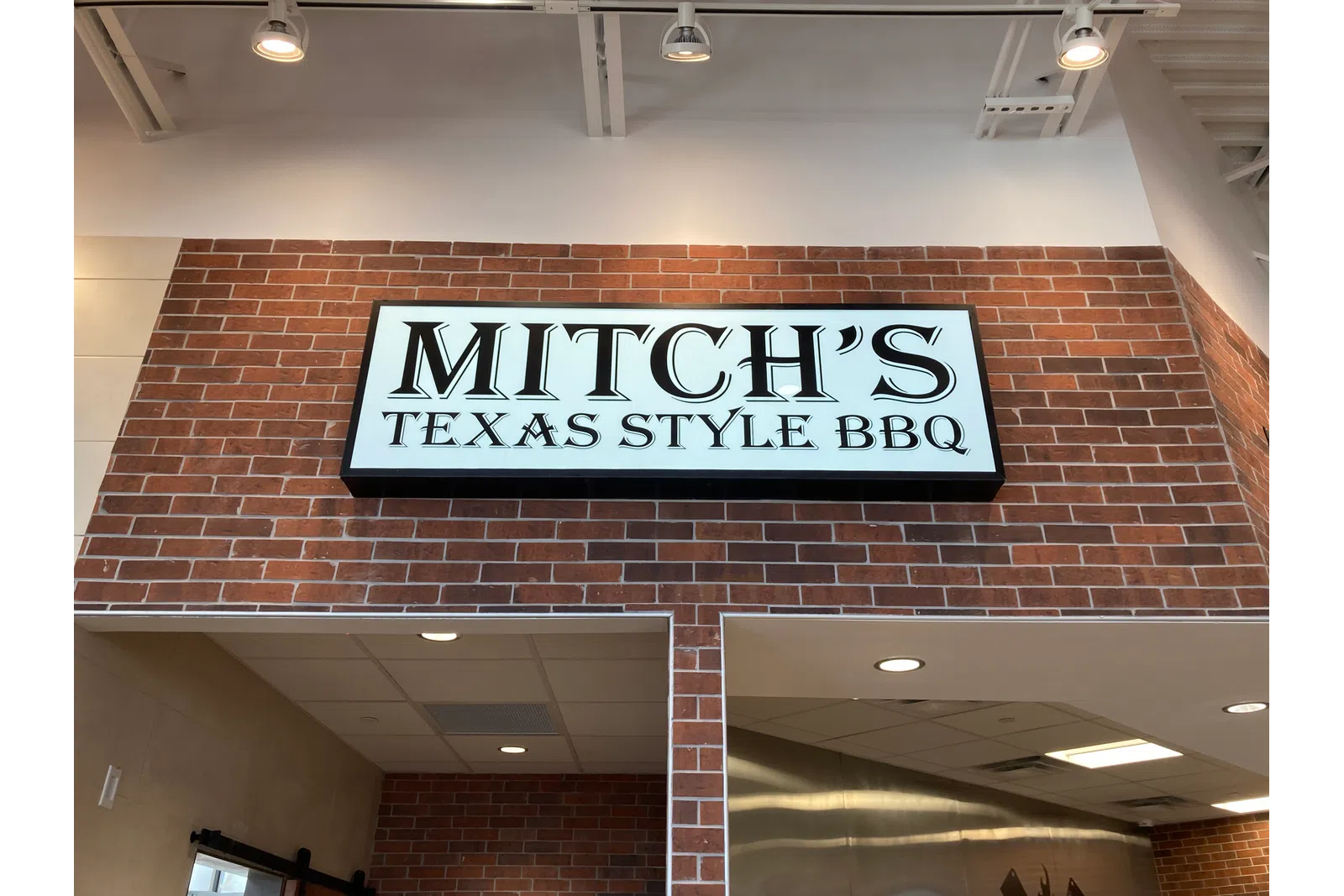 a sign on a brick wall