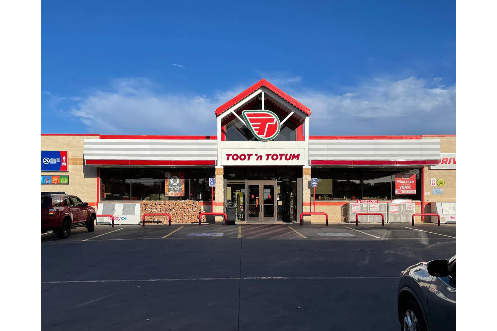 a store front with a red sign