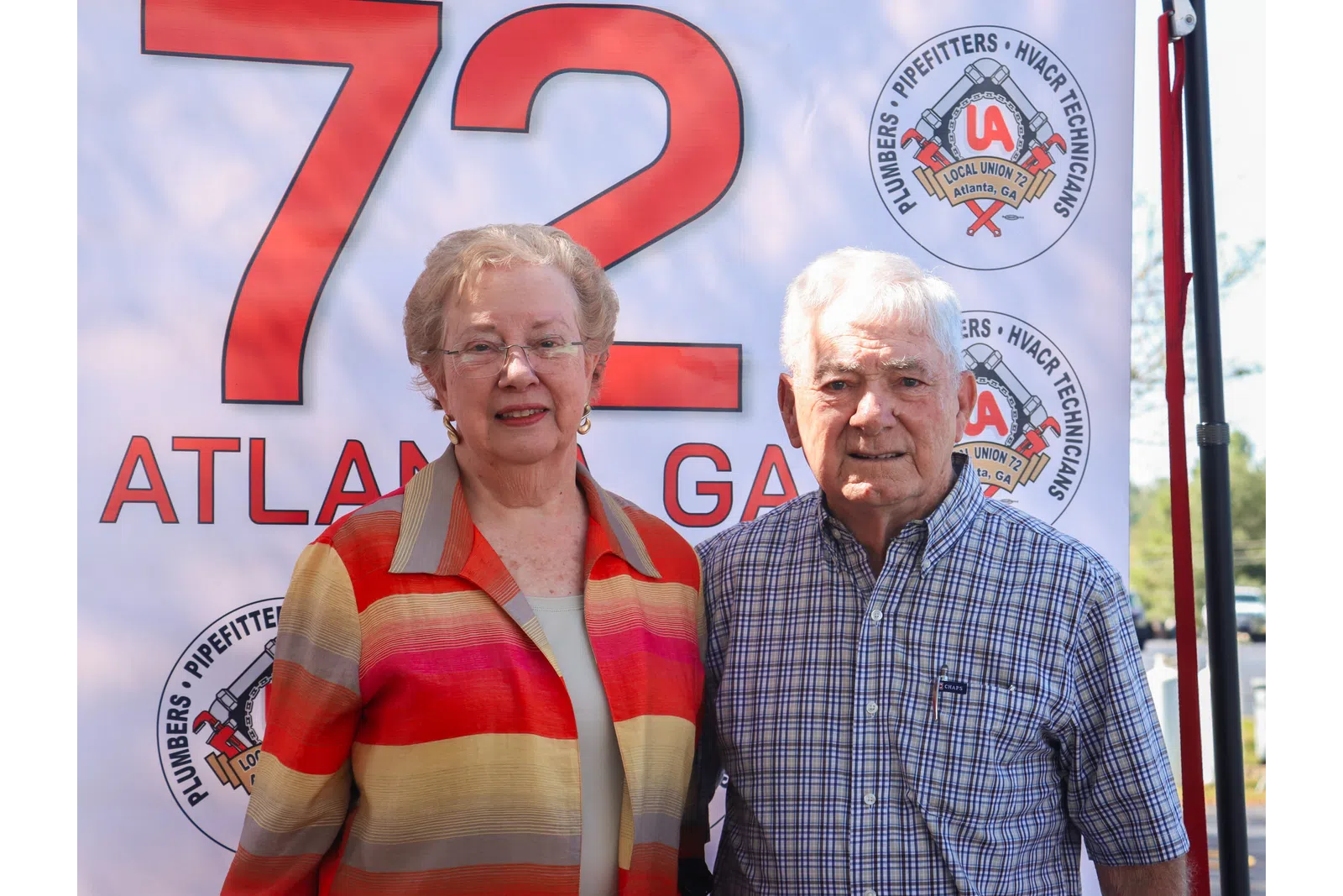 a man and woman smiling