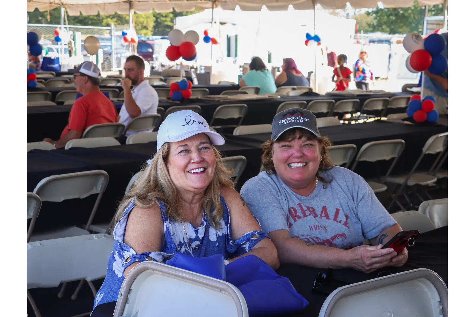 a couple of people sitting in a stadium