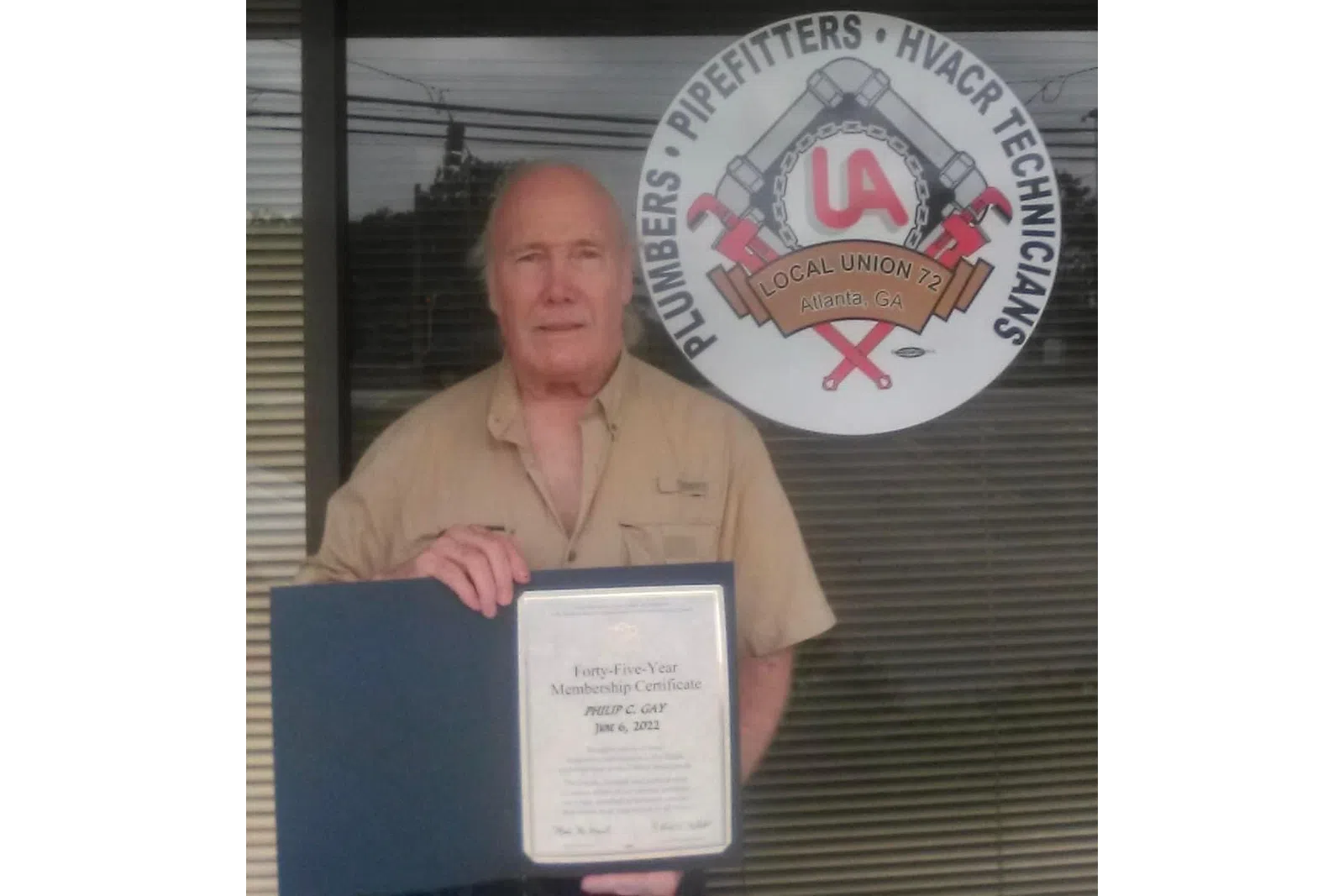 a person holding a certificate