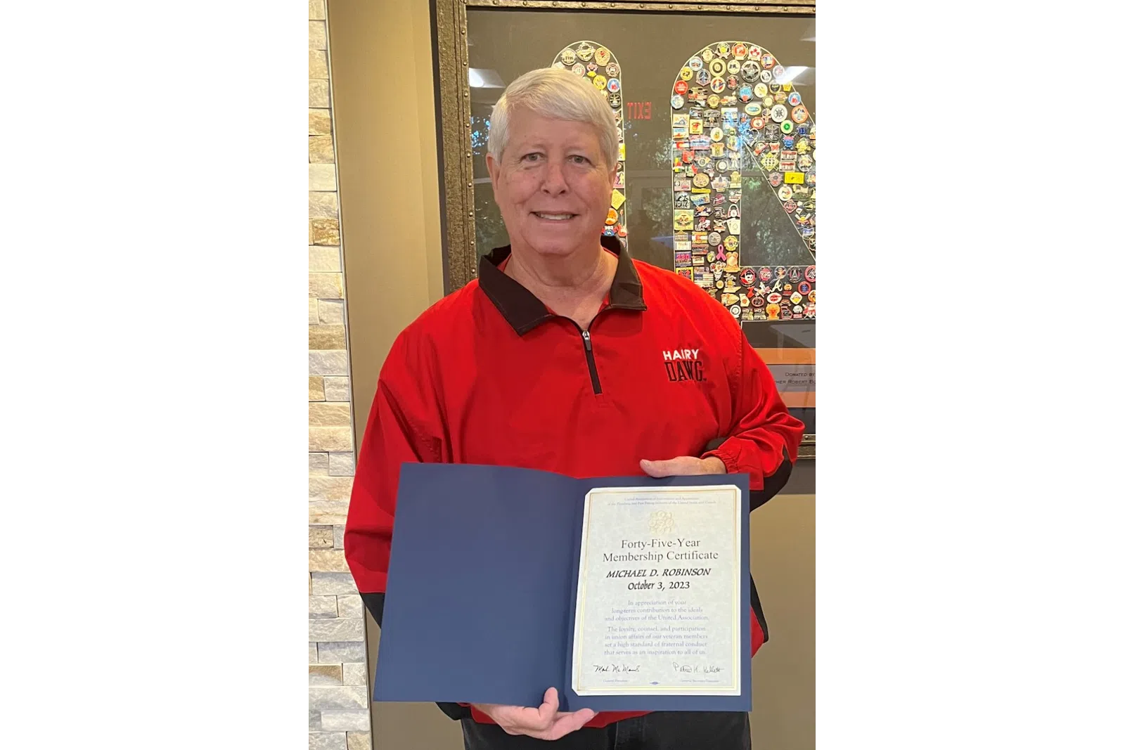 a person holding a certificate