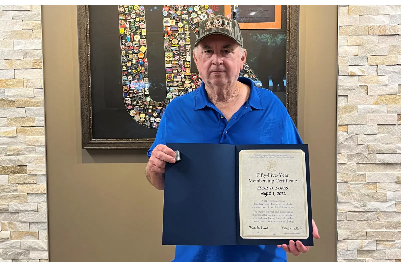 a person holding a framed picture