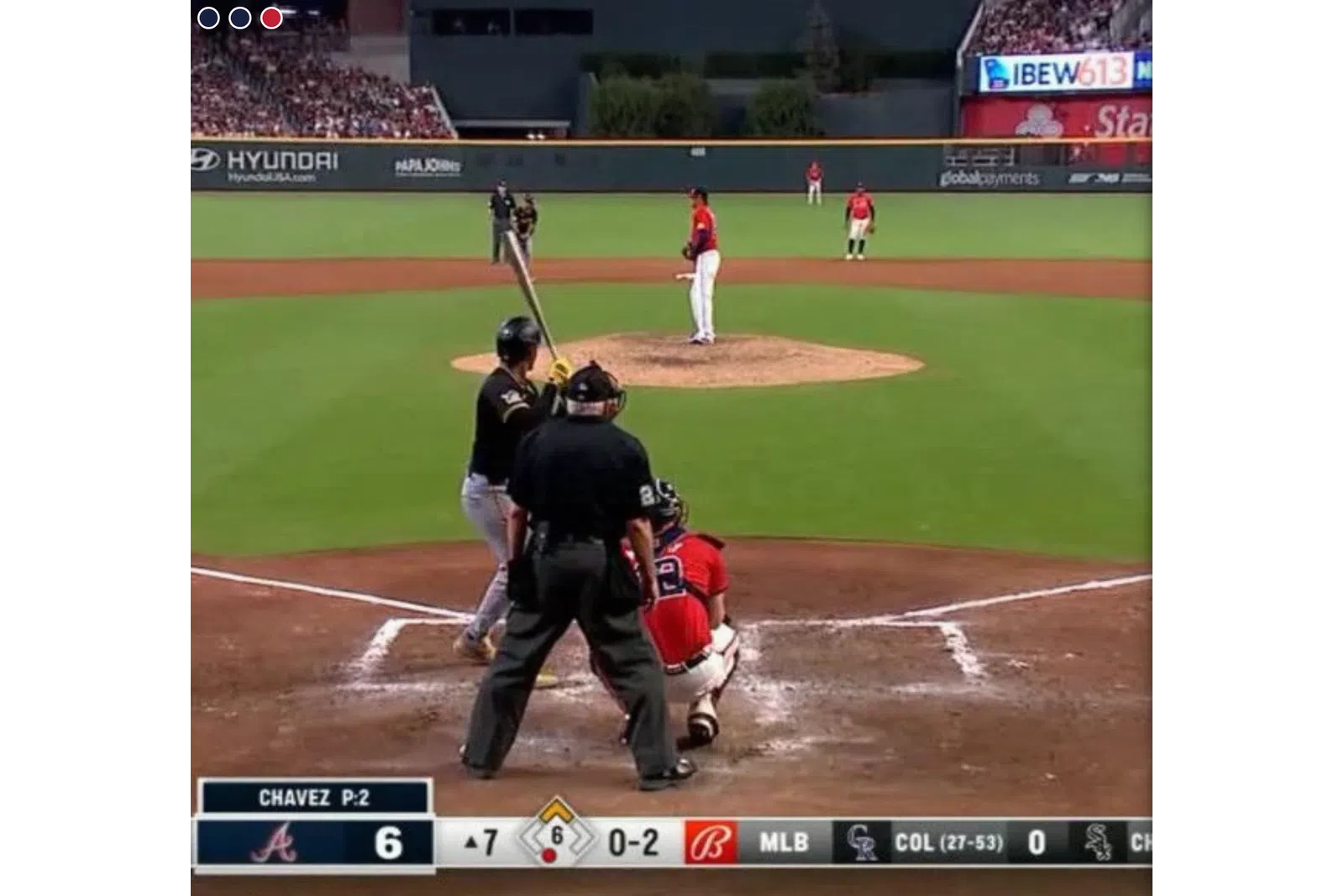 a baseball player prepares to swing a bat