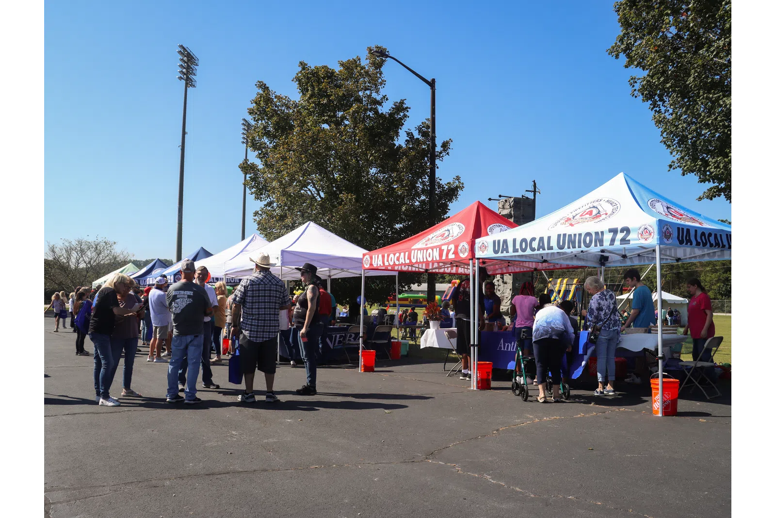 a group of people at an outdoor market