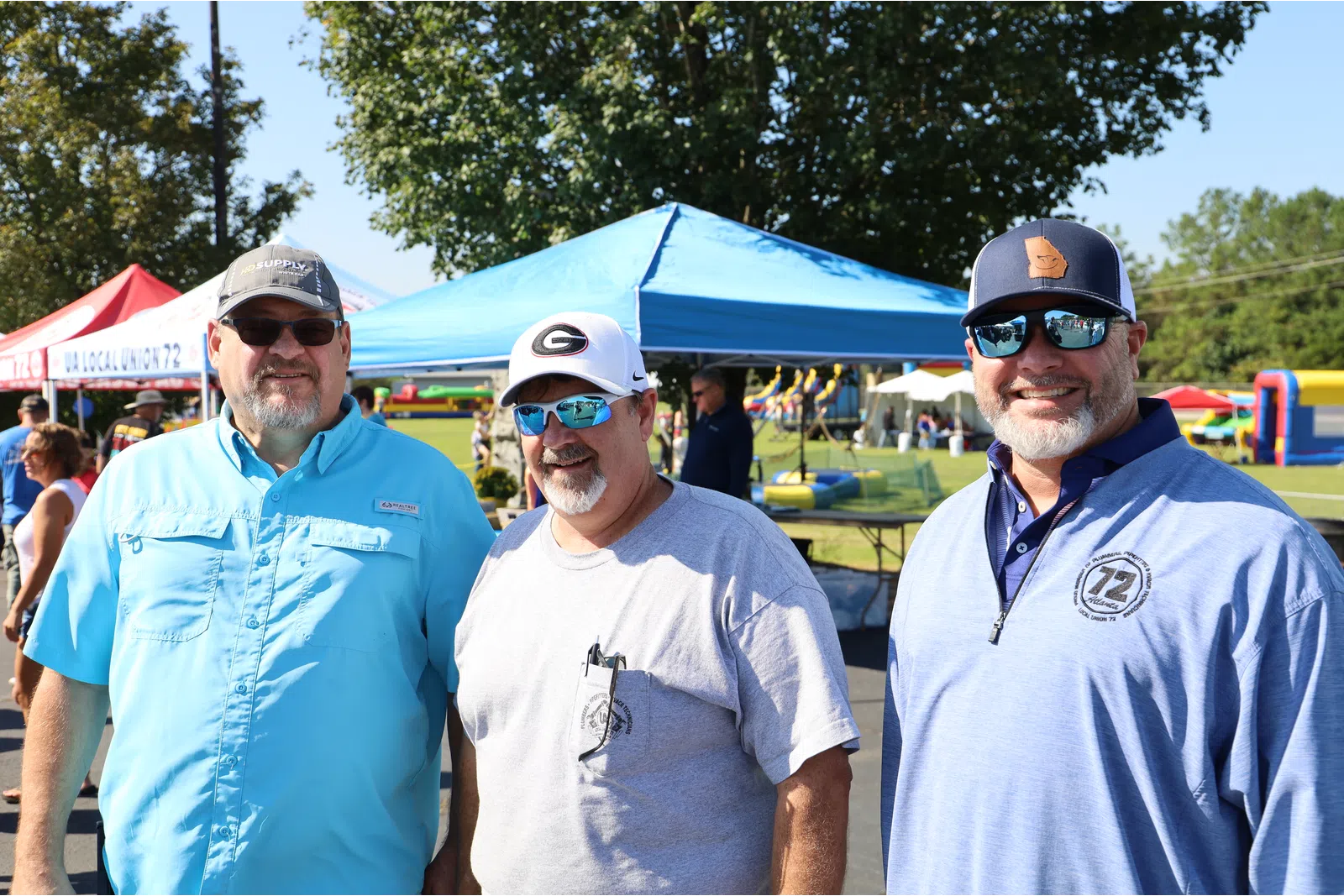 a group of men wearing sunglasses