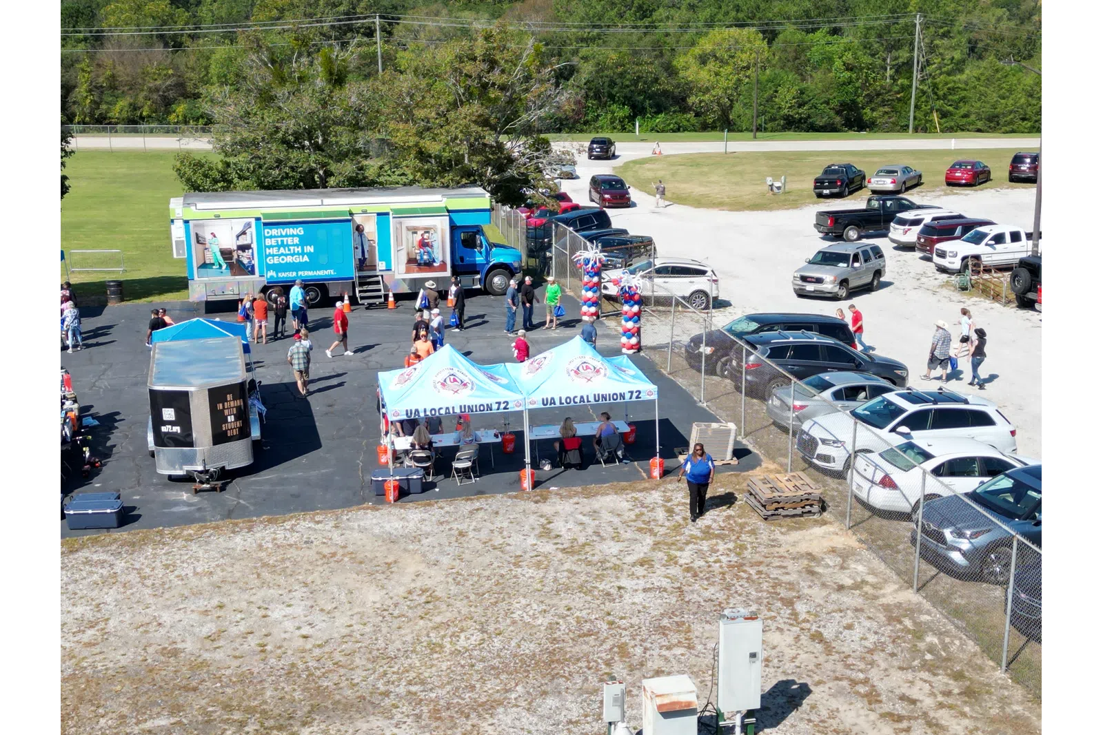a group of people at a car show