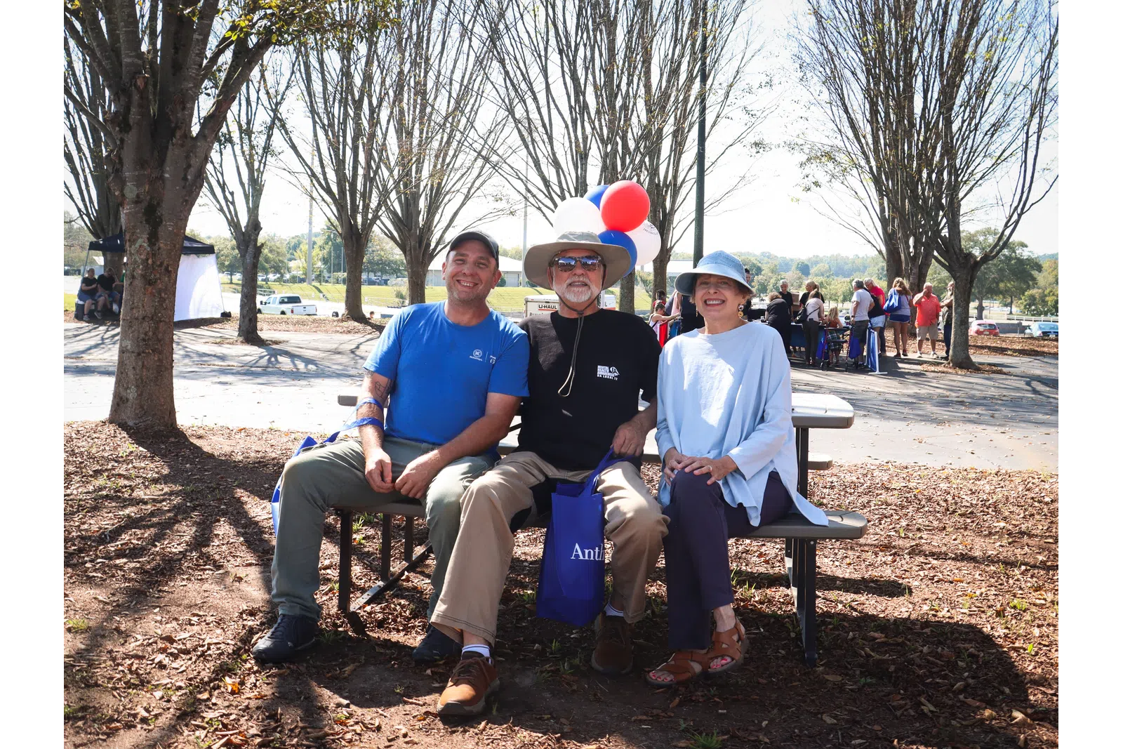 a group of people sitting on a bench