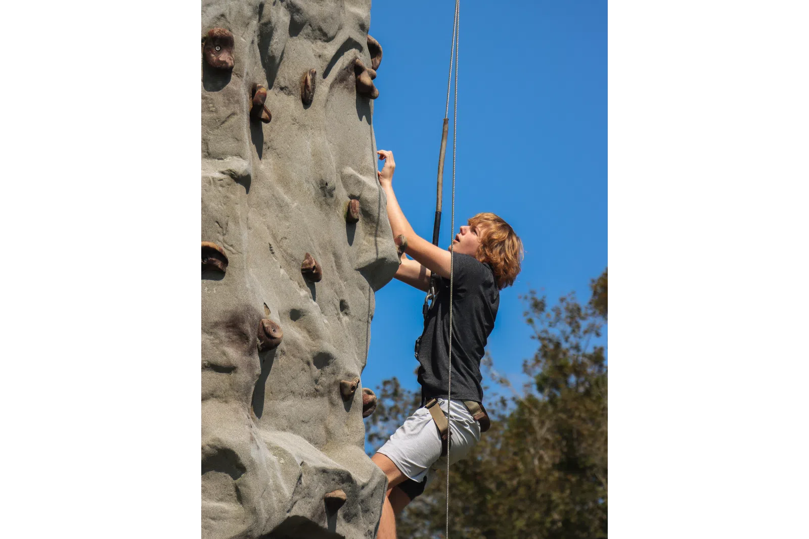 a man climbing a rock