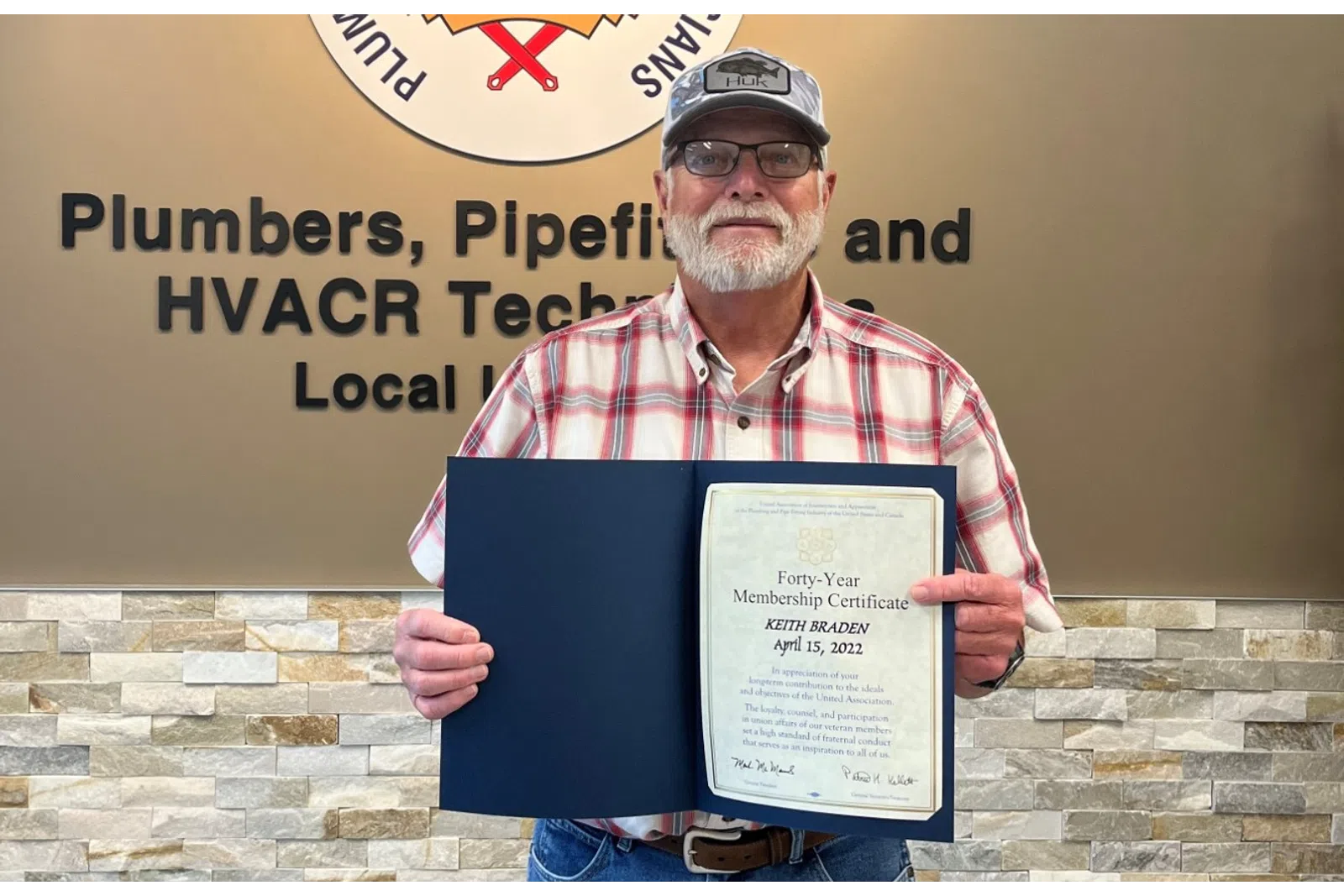 a person holding a plaque