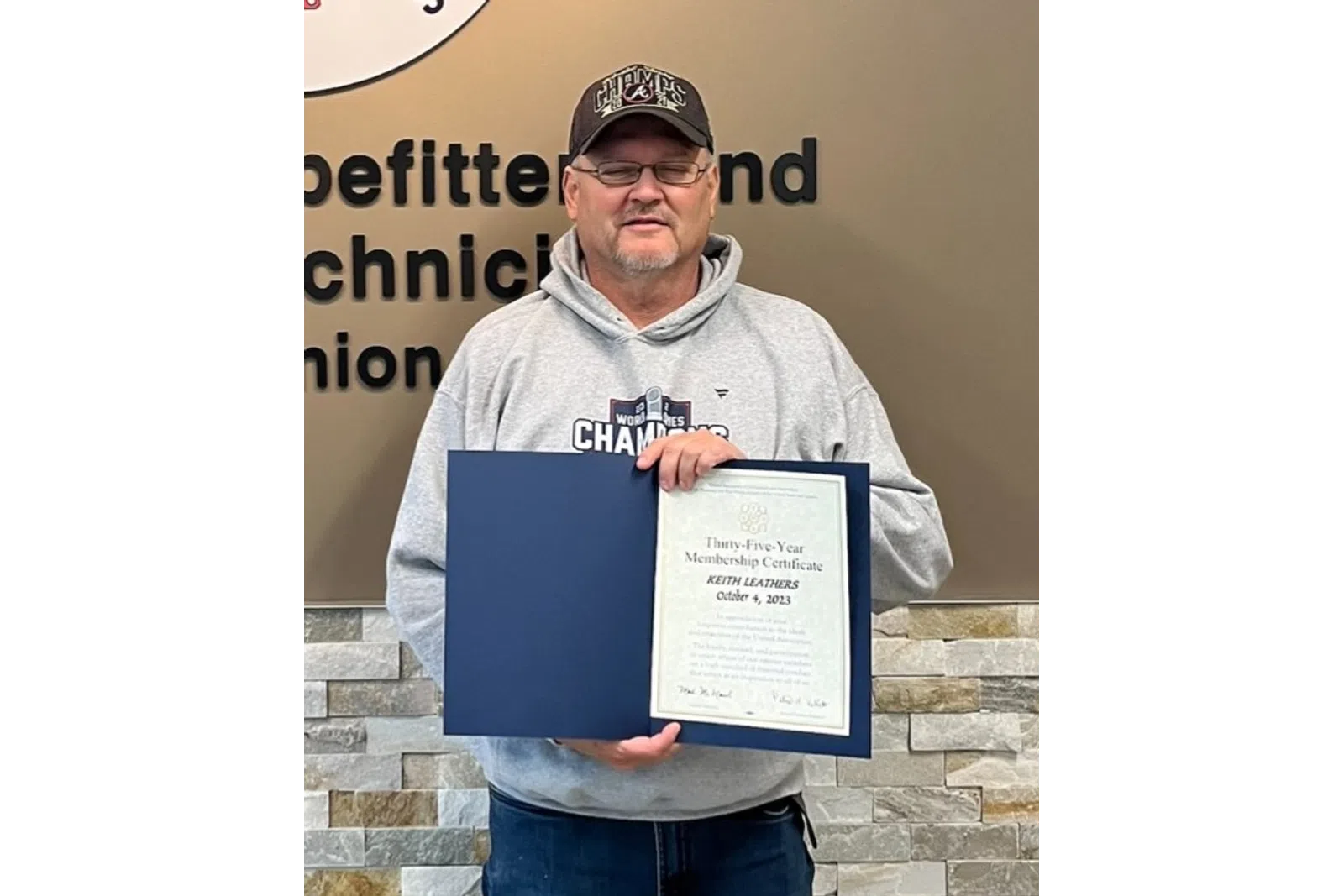 a person holding a certificate