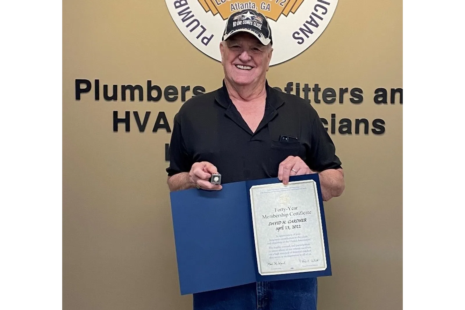 a person holding a certificate