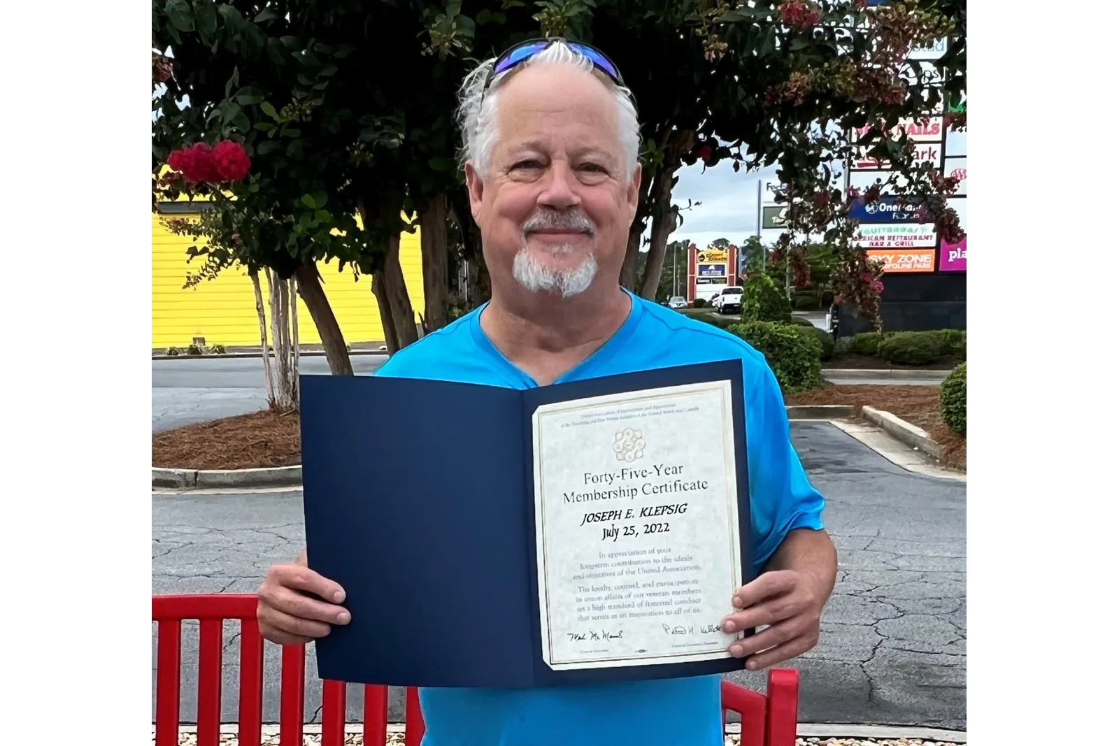 a person holding a certificate