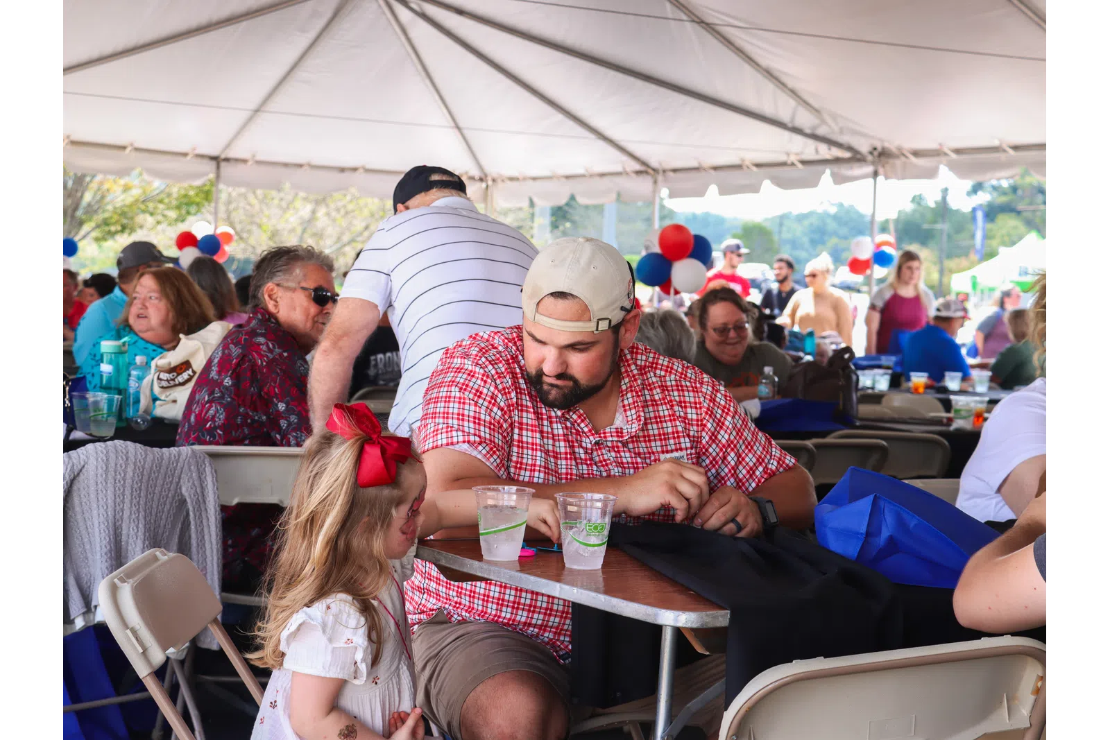 a group of people sitting at tables